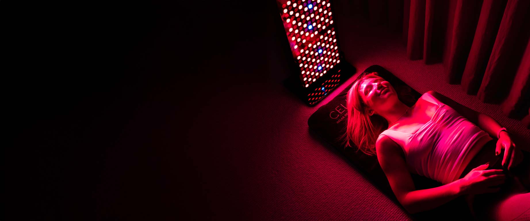 Laying on CELLER8 full body PEMF therapy mat