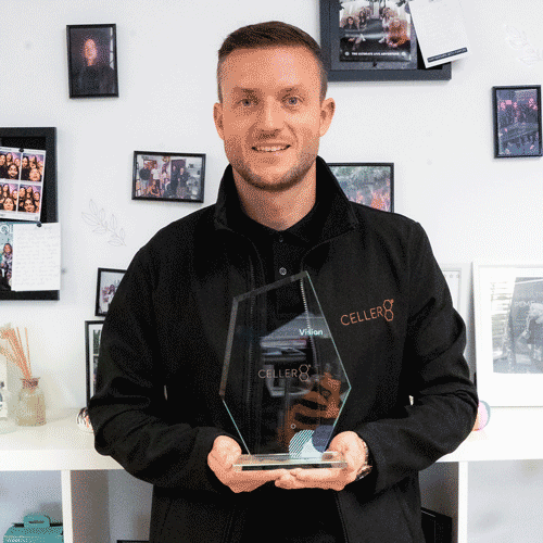 Andy holding Award for Best PEMF Therapy Device Brand 2025 by Corporate Vision