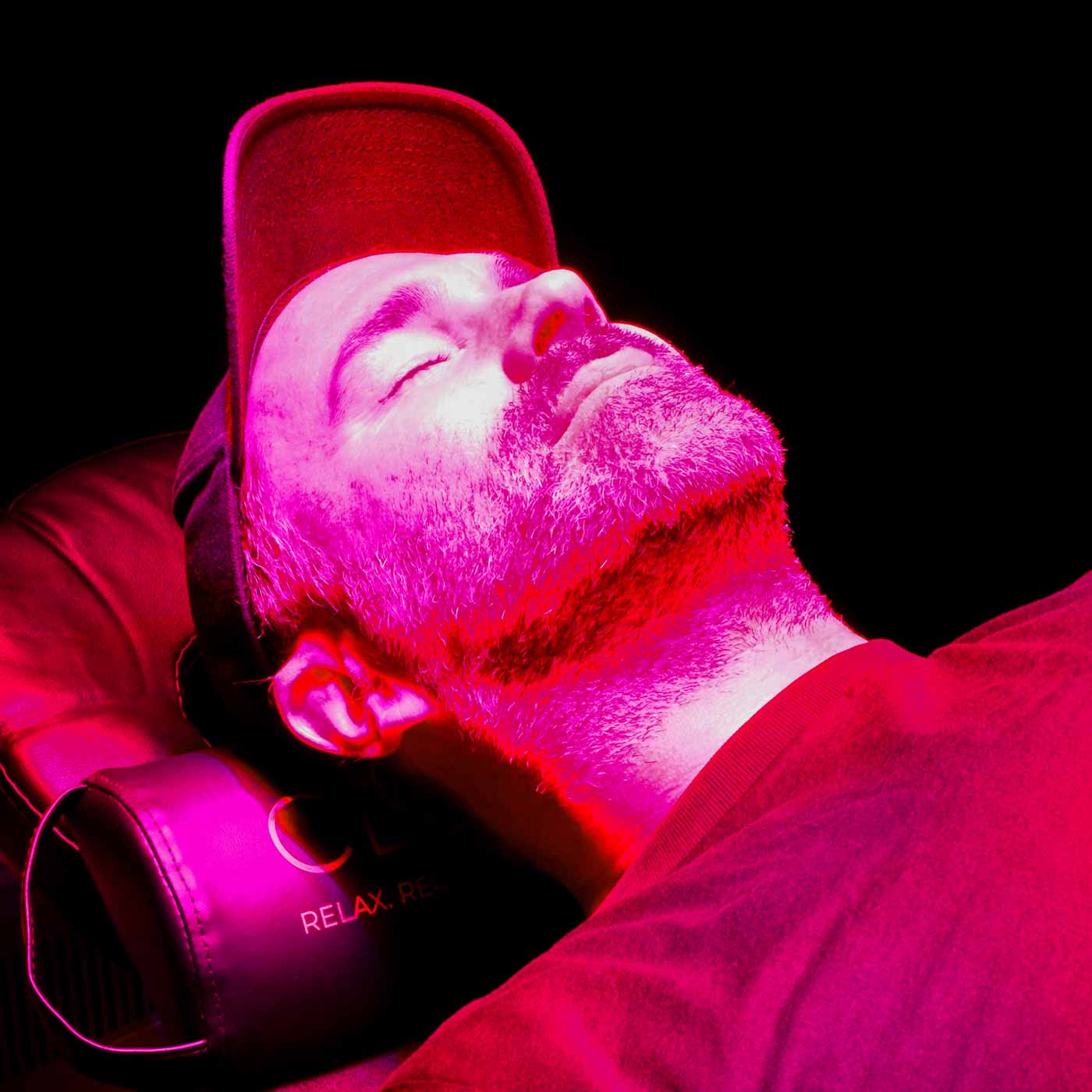 Eddie Hearn laying on red light panel
