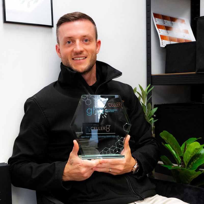 Andy holding Best PEMF Therapy Technology Brand 2025 from Global Health and Pharma