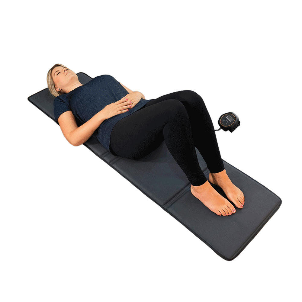 Women laying on PEMF mat