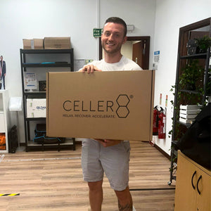 Andy holding first CELLER8 full body mat package box