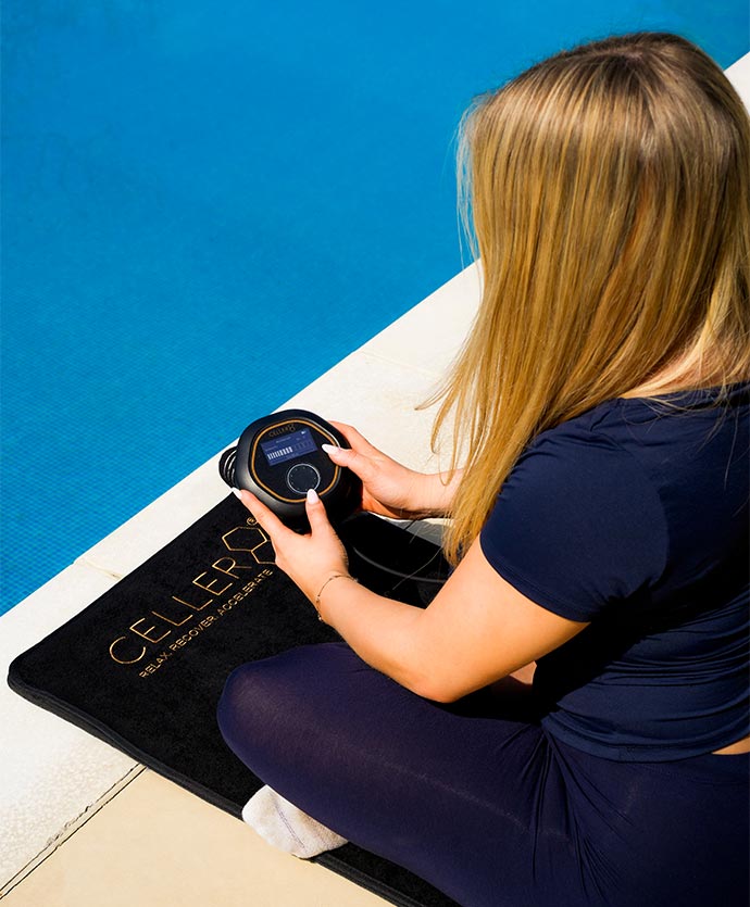 Women adjusting CELLER8 next to pool